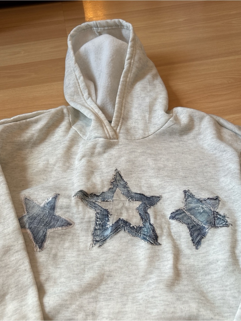 SHEIN Cream Hoodie with Distressed Blue Star Patches
